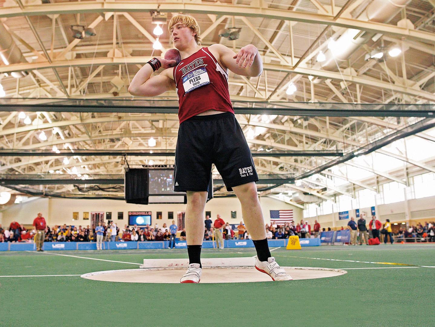 David Pless ’13 prepares to throw the shot, en route to winning his second consecutive NCAA Division III indoor title in 2012 and breaking the NCAA Division III Indoor record by 9.5 inches. Photograph by Stephen Mally/NCAA.