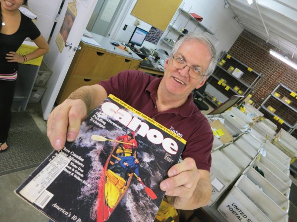 Gregg "Vinnie" Vincent, Bates campus mail supervisor, shows off the May 1987 issue of Canoe magazine that arrived from the USPS at Bates on April 13, 2012.