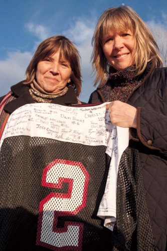 After the game McDuffee’s mother, Lisa Freeman (left), and her sister, Laura Birdsall, pose with McDuffee’s Bates lacrosse jersey, signed by both teams. Photograph by Phyllis Graber Jensen/Bates 