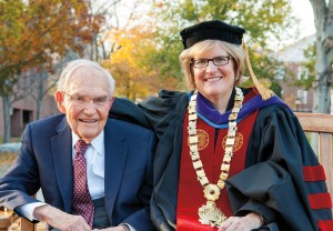 Left, a poignant moment during the installation: Clayton Spencer hoists her academic cap, the same one that her father, Samuel Reid Spencer Jr. — now 93 and seen below with his daughter after the ceremony — wore as president of Mary Baldwin College and Davidson College. From an early age, Clayton recently told The Chronicle of Higher Education, she experienced the liberal arts college as a “distinctive alchemy of people and ideas.” Photograph by Rene Minnis