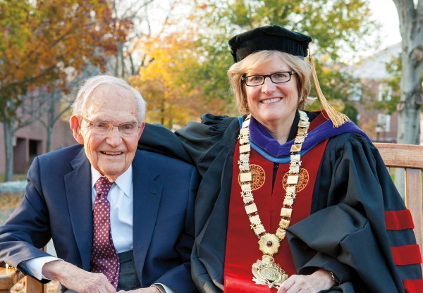 President Spencer and her father, Samuel Reid Spencer Jr, sit together on a campus bench after the ceremony. Her father and her mother, Ava, attended the installation, as did Clayton's children. Photograph by Rene Minnis