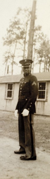 Wearing dress blues, Marine Cpl. Nate Boone poses for an unnamed buddy in front of a barracks at Montford Point, Camp Lejeune, N.C., in 1947. Photograph courtesy the Boone family