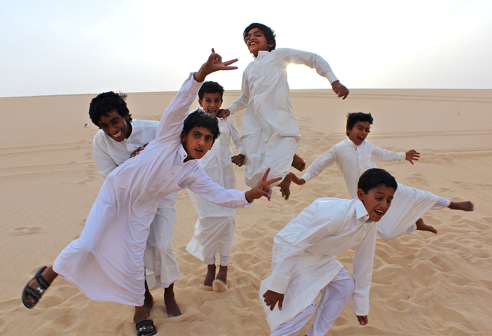 Saudi boys cavort in the desert. Photograph by Gintare Balseviciute '13