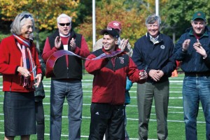 Hansen and Director of Athletics Kevin McHugh cut the ribbon at the dedication of renovated Garcelon Field in 2010. Photograph by Janet Cuimmei P'12. 