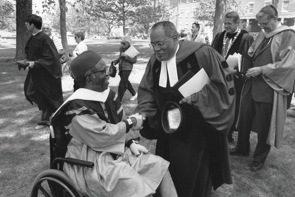 Gomes and Nigerian novelist Chinua Achebe greet one other after Commencement 1996, when both received Bates honorary degrees. Photograph by Marc Glass '88/Bates College. 