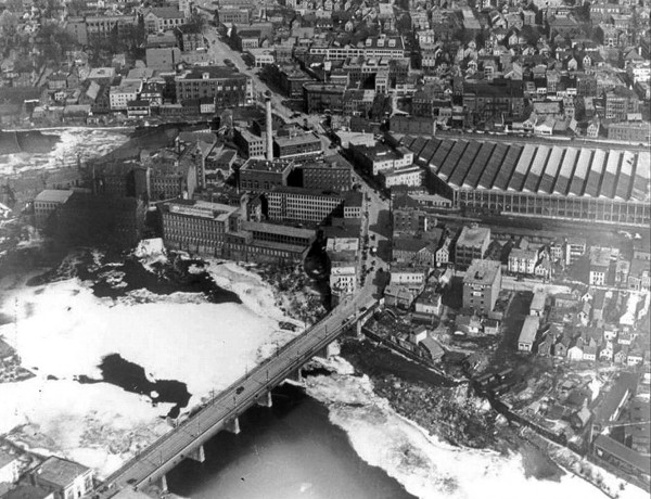 Along with foam and scum in the Androscoggin River at the Great Falls, circa 1930, was a strong smell. Photograph courtesy of the Androscoggin Historical Society.