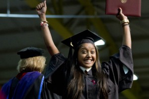 An exuberant Zaihra Ahmed '13 shows off a product of four years' hard work at Bates. Photograph by Phyllis Graber Jensen/Bates College.