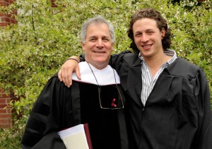 Commencement speaker and honorary degree recipient Gary Hirshberg and his graduate son, Ethan '13, pose for a photograph after the ceremony. Photograph by Jose Leiva.