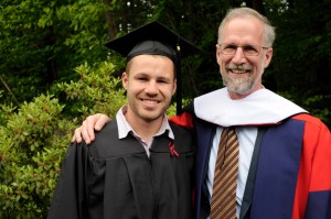 Honorary degree recipient William Cronon and his Bates graduate son, Jeremy '13, pose for a photograph after the ceremony. Photograph by Jose Leiva.