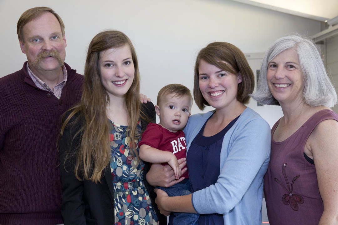 From left, Donald Wason '79 with daughters Sarah '13 and Rebecca Wason St. Cyr '09 and wife Nancy '81. Rebecca holds her son -- future Bates Class of 2034?