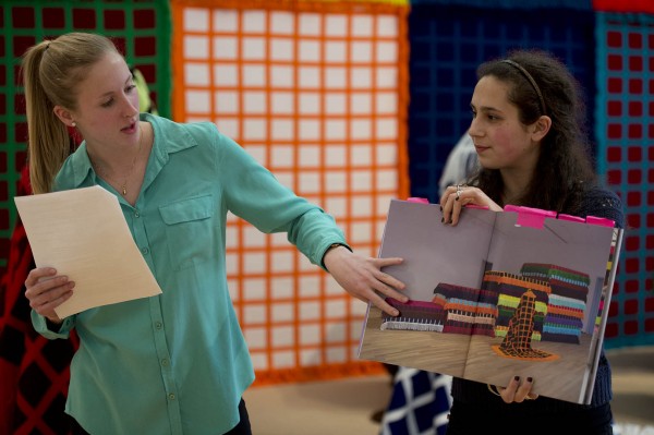 Bates Museum of Art interns Eliza Pyne '13, at left, and Irem Ikizler '15 discuss the art of Fransje Killaars in a March gallery talk for Killaars' "Color at the Center," an exhibition they helped prepare. Photograph by Michael Bradley/Bates College.