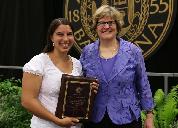 Julia Sleeper '08, recipient of the Distinguished Young Alumni Award at Reunion for her work with Tree Street Youth Center in Lewiston, poses with President Clayton Spencer. Photograph by H. Lincoln Benedict '09.