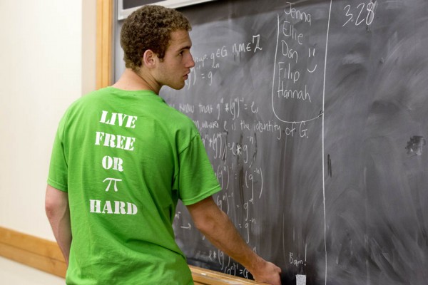 Creating knowledge: Daniel Paseltiner '16 works on mathematical group theory for the course nicknamed "Math Camp" during Short Term 2013. Photograph by Phyllis Graber Jensen/Bates College.