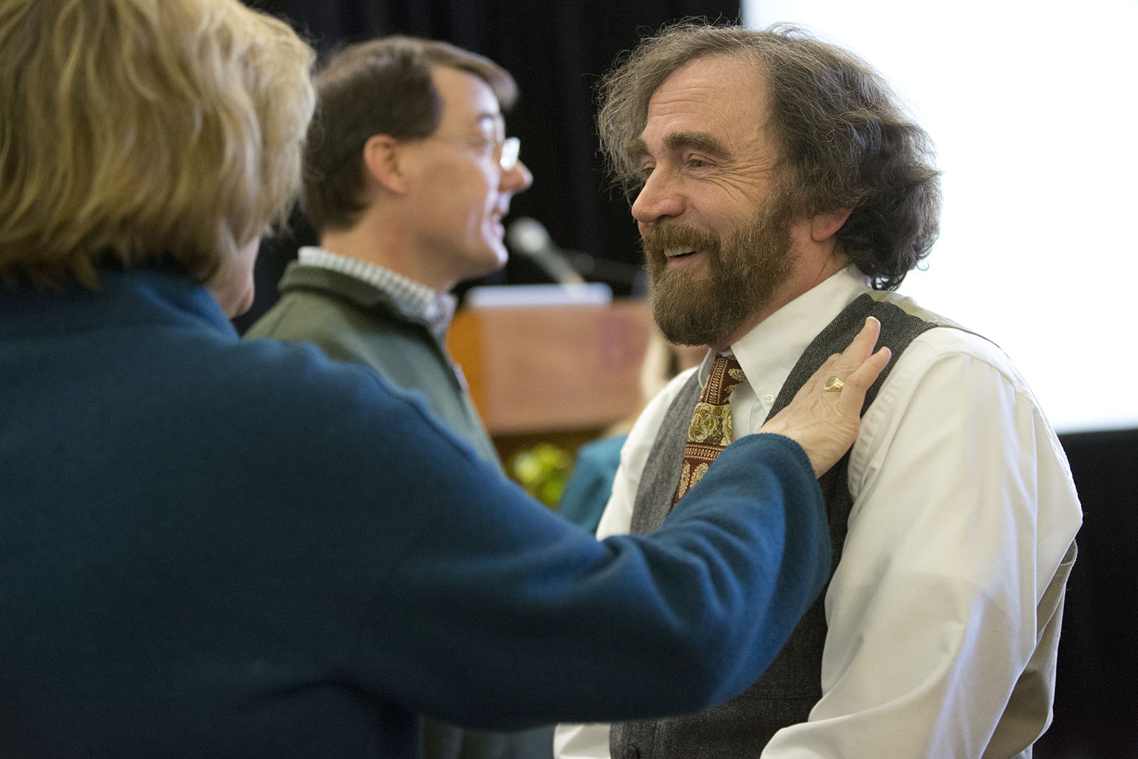 Glen Lawson receives congratulations from President Spencer at the celebration of his appointment as the Charles A. Dana Professor of Chemistry. (Phyllis Graber Jensen/Bates College.)