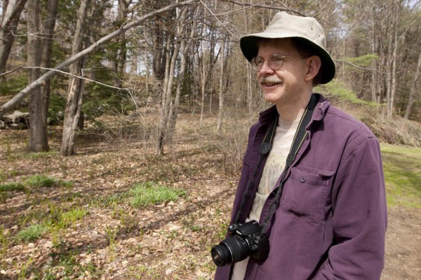 Professor of Biology Robert Thomas, photographed at the McLaughlin Garden in South Paris, Maine, while teaching the Short Term course "Nature Photography" in 2008. (Phyllis Graber Jensen/Bates College)