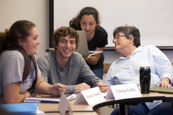 Professor of Classical and Medieval Studies Margaret Imber consults with students during her first-year seminar "Trials of Conscience." (Phyllis Graber Jensen/Bates College)