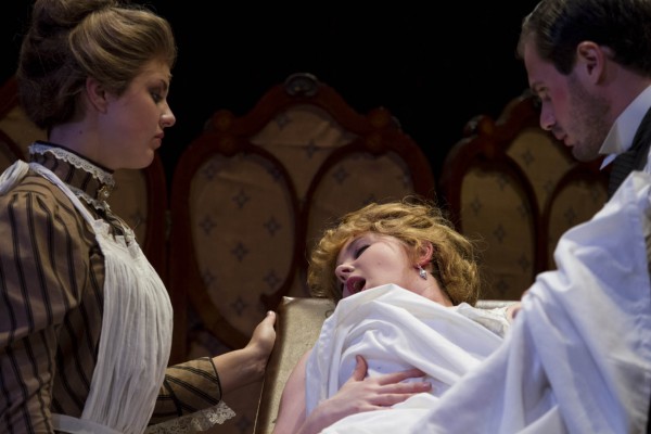 From left: Audrey Burns '17, Liza Danello '14 and Sam Metzger '14 perform during a dress rehearsal for the Bates College production of "In the Next Room (or the vibrator play)." (Sarah Crosby/Bates College)