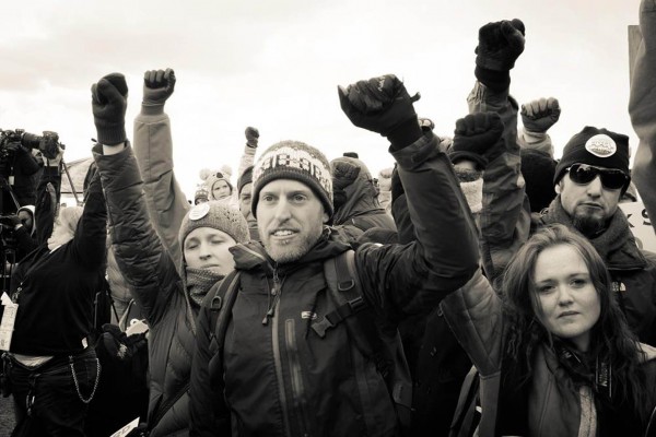 Phil Aroneanu (center) discusses climate change activism at Bates on Nov. 9.