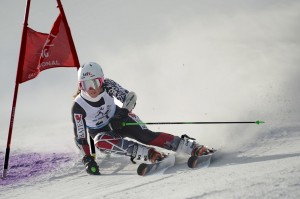 Emily Bamford '15 zooms past a gate in the giant slalom at the NCAA East Regional Meet in February 2013. (Photo: Cory Ransom)