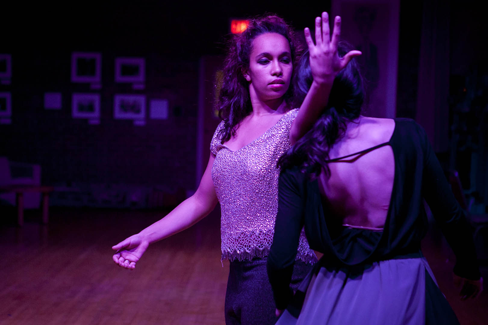 Colleen Fitzgerald '14 (facing camera) is shown with XXX during a dress rehearsal of "Intricate Glances Will Meet Here." (Sarah Crosby/Bates College)