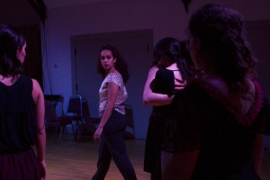 Colleen Fitzgerald watches her dancers during a dress rehearsal of "Intricate Glances." (Sarah Crosby/Bates College)