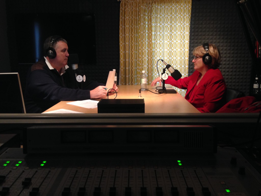 President Clayton Spencer speaks with Steve Woods of TideSmart Talk in the studio. Photo courtesy of TideSmart Radio.