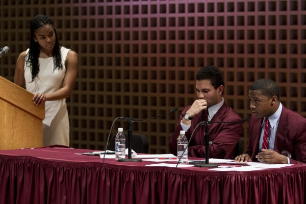 Debater Shannon Griffin '16, left, listens to an objection Monday during The Reverend Benjamin Elijah Mays Debate between Bates and Morehouse colleges in the Olin Arts Center. (Sarah Crosby/Bates College)