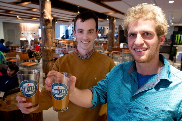 Downeast Cider co-founders Tyler Mosher '11 (left) and Ross Brockman '11 held a tasting in the Bobcat Den last spring. (Phyllis Graber Jensen/Bates College)