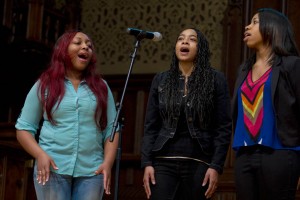 Members of the Gospelaires perform during Bates' 2014 Martin Luther King Jr. Day keynote session. (Sarah Crosby/Bates College)