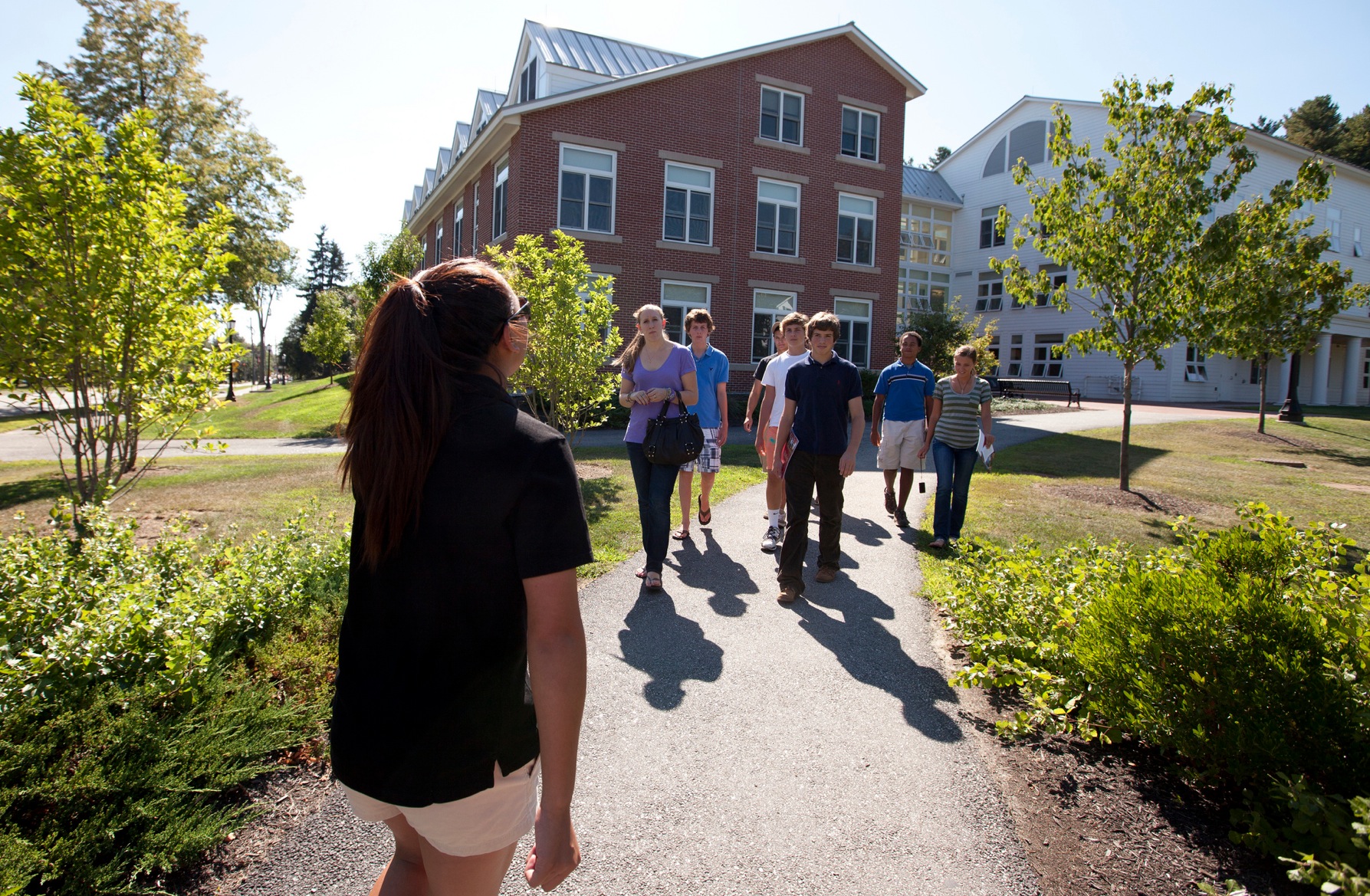 Janelle Lyford '13, admission tour guide, gives a midsummer tour of the Bates campus.