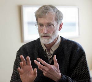 Religious studies professor Tom Tracy appears in his classroom in an image by Phyllis Graber Jensen.