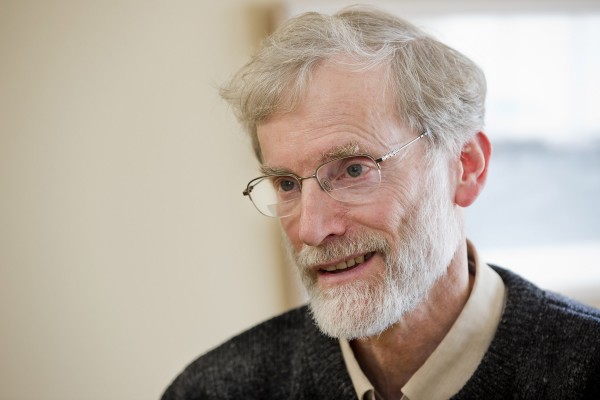 Horizontal portrait of Phillips Professor of Religious Studies and Philosophy Thomas Tracy by Phyllis Graber Jensen.