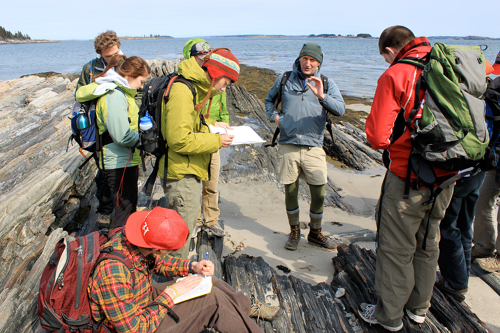 During a field trip to Cliff Island, Professor of Geology Dykstra Eusden '80 teaches students how to identify and measure different rock formations in order to create a map in ArcGIS, a mapping and spacial analysis tool. (Judson Peck '11)