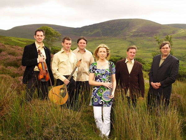 The popular traditional Irish band Danú against an Irish landscape, taken by Colm Henry.