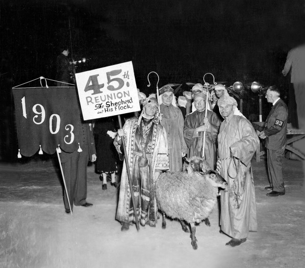 In 1948, this “display of livestock” won  best costume for the Class of 1903. The sign holder, Class President Alexander Maerz, is next to classmates George Ramsdell, a longtime Bates math professor, and Carl Sawyer. Ralph Johnson, right, wrangled the sheep for the class. Photograph courtesy of the Edmund S. Muskie Archives  and Special Collections Library