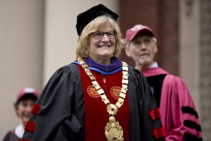 Bates President Clayton Spencer beams during Commencement 2014. Behind her is geology professor and faculty marshal John Creasey. (Phyllis Graber Jensen/Bates College)