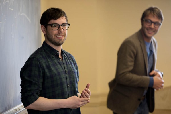 Jeremy Fisher '06 explains the art of the pitch as Ben Schippers '04 looks on. Fisher was a guest speaker in Schipper's Short Term course on digital innovation on May 6, 2014. (Phyllis Graber Jensen/Bates College)