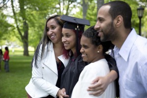 Cecilia Pina '14 of Boston poses with Katia, Cecilia and Vadilson Pina during a family photo session at Commencement 2014. (Phyllis Graber Jensen/Bates College)