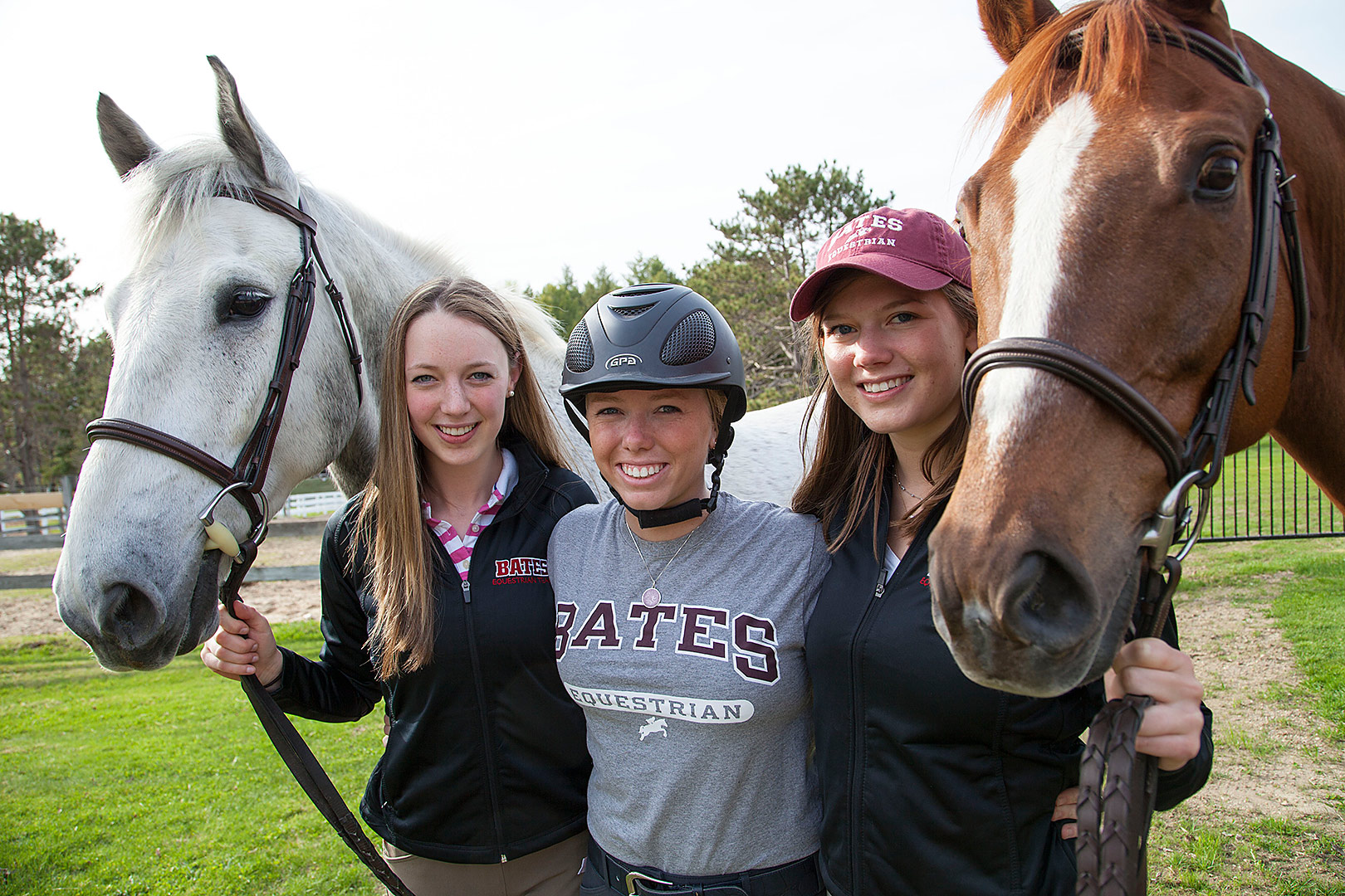 Otis (left) and Juno (right) flank Bates Equestrian Club members Katie Kirwin '15, Carolyn Attenborough '15 and Hannah Kiesler '16.