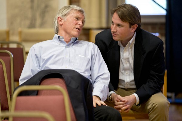 Father and son entrepreneurs David Shaw and Ben Shaw ’00 consult before their May 5 talk, "Adventures in Business and Social Entrepreneurship," part of the spring's “Purposeful Work: Voices in Entrepreneurship" series. David Shaw returned to Bates at Commencement to receive an honorary degree. (Phyllis Graber Jensen/Bates College)