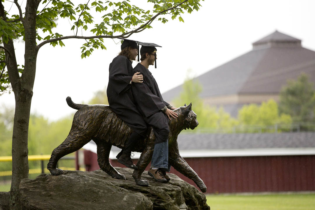After Baccalaureate, the Bobcat carries two graduating seniors into the sunset. (Phyllis Graber Jensen/Bates College)