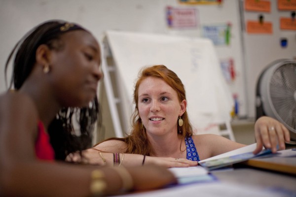 Brenna Callahan works with an unidentified pupil at Montello School. (Phyllis Graber Jensen/Bates College)