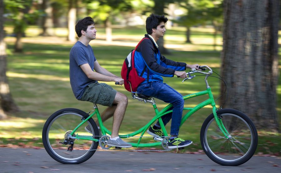 Students tandem biking on Bates campus