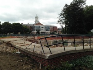 Site of the former 75 Campus Ave., once the home of Bates' religion and philosophy faculties, shown on Aug. 12, 2014. Lewiston Middle School is in the background. (Doug Hubley/Bates College)