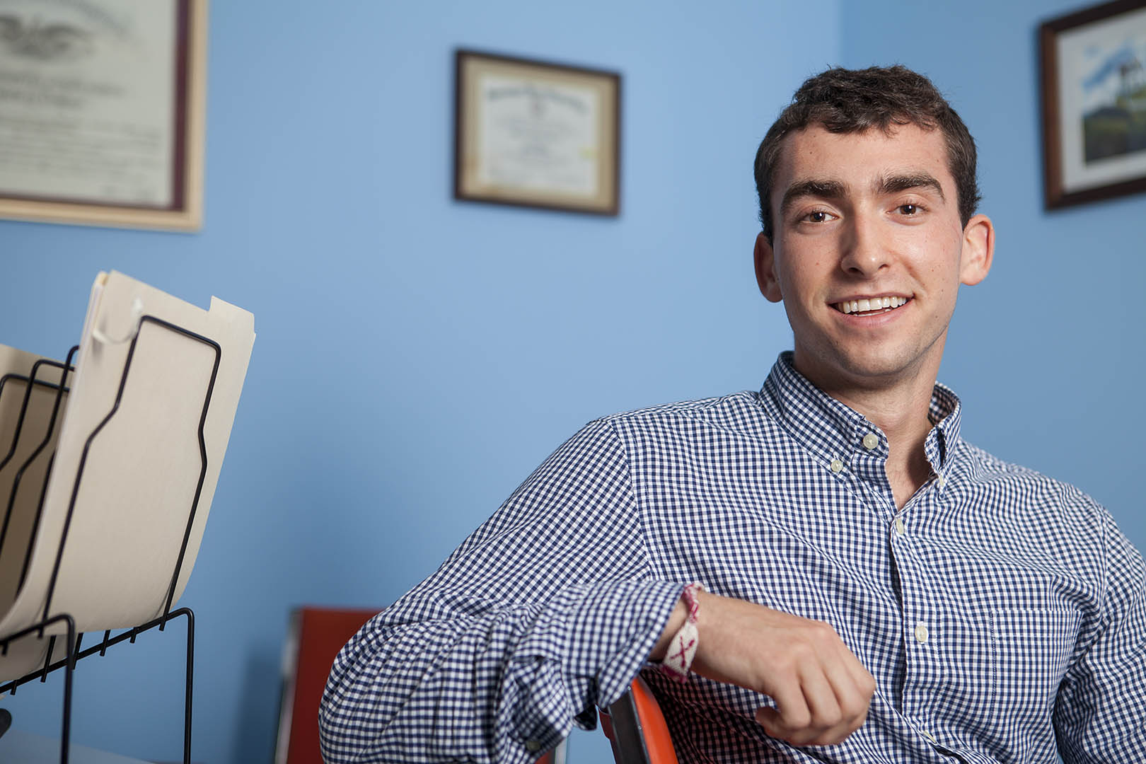 Evan Cooper '15 poses for a portrait at Pine Tree Legal, where he is working to provide legal aide to those who can't afford it, during a summer internship sponsored by the Harward Center. (Sarah Crosby/Bates College)