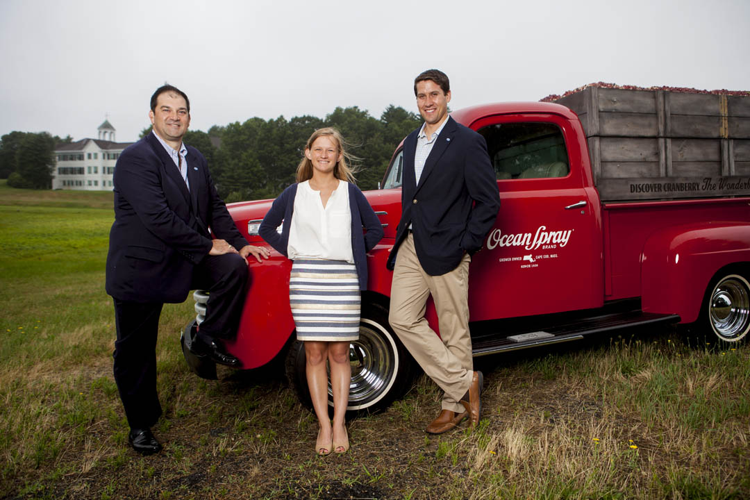 At Ocean Spray headquarters in Middleborough, Mass., Peter Wyman '86 (left) joins Pat Quinn '12 and Ladd Intern Kelsey Mehegan '15 of Duxbury, Mass., for a photograph. Wyman is vice president for global business development at Ocean Spray, while Quinn is associate trade marketing manager. (Sarah Crosby/Bates College)