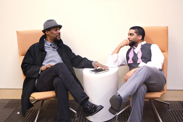 Theater director Ozzie Jones '92 (left) talks with David Wall Rice, professor of psychology at Morehouse College, following a 2012 Bates conference of black and latino men from Colby, Bates and Bowdoin colleges. (Simone Schriger '14/Bates College)