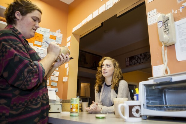 Colette Girardin ‘16, at right, orders a chai latte at le Ronj on Sept. 18, the first day of breakfast hours for the coffeehouse. Stocking Manager Max Pendergast ‘15 serves coffee and breakfast from 7-10 a.m.