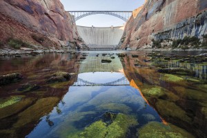 Cold water trickles out of the Glen Canyon Dam into what's left of Glen Canyon, forming an unnatural stretch of trout water on the Arizona/Utah border, in a scene from "DamNation." (Ben Knight)