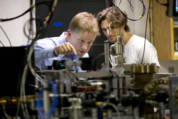 Physics major Ben Lovitz '15 of Portland, Ore., works with assistant professor Nathan Lundblad in his ultra-cold atomic physics lab. Graduates of Lundblad's lab have earned admission to top research programs at MIT, Berkeley, Stanford and the University of Michigan, among others. (Phyllis Graber Jensen/Bates College)